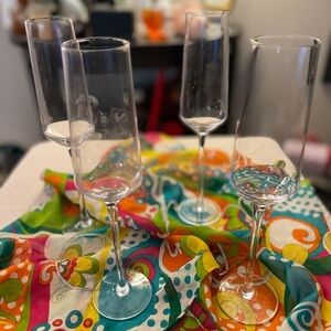 Coymos clear glass champagne flute set of four in original box 10.5” high.